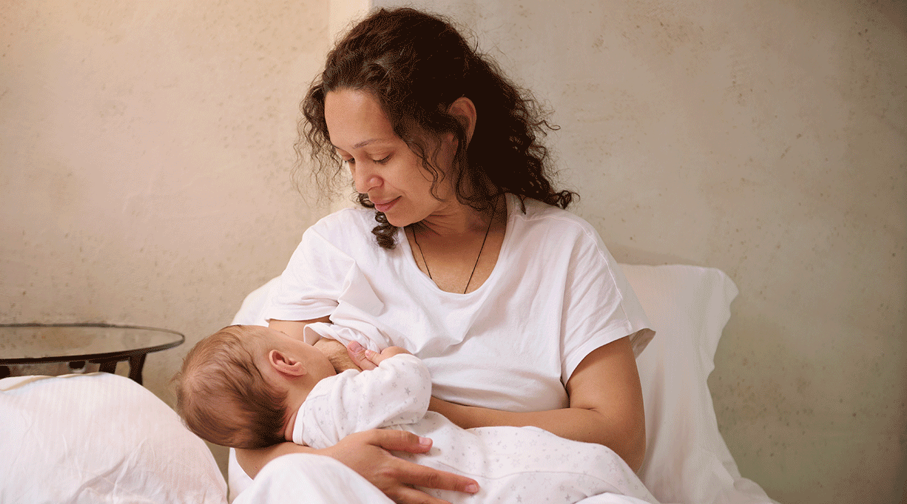 mother breastfeeding infant baby