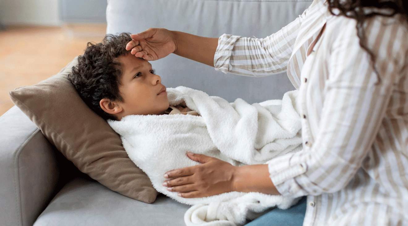 mom caring for sick child at home