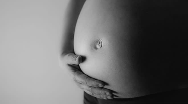 close up of baby bump in black and white