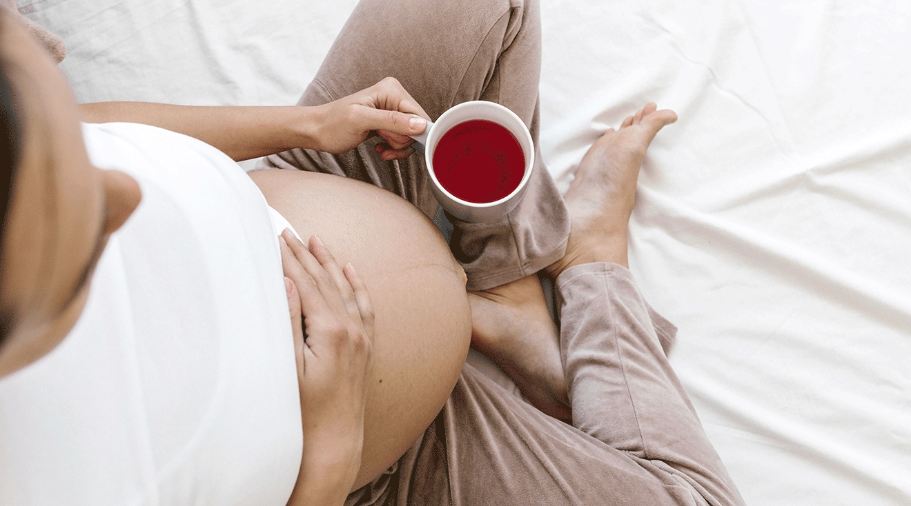 pregnant woman drinking red raspberry leaf tea