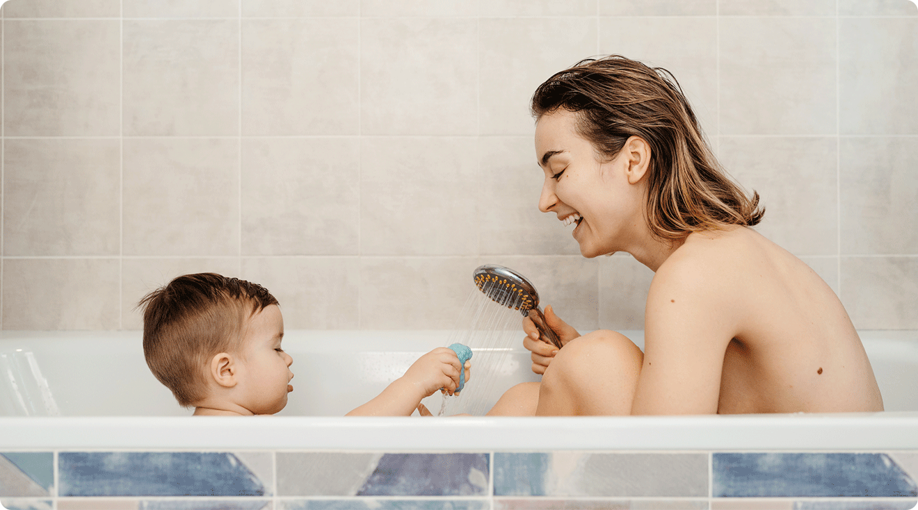 mom bathing with her toddler, a common scene for a "naked mom" or "naked family"
