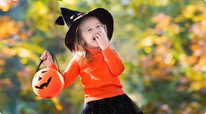 happy toddler dressed up for halloween