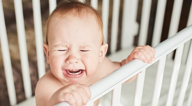 one year old baby crying in crib
