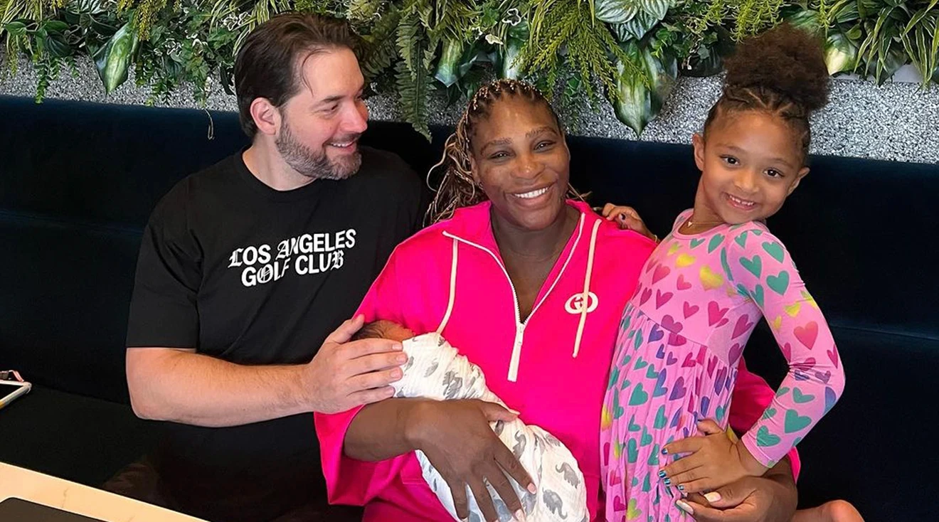 serena williams holding newborn baby with husband and daughter