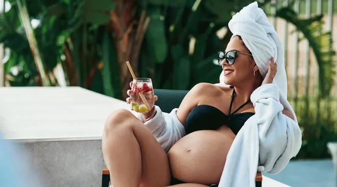 pregnant woman relaxing at a resort