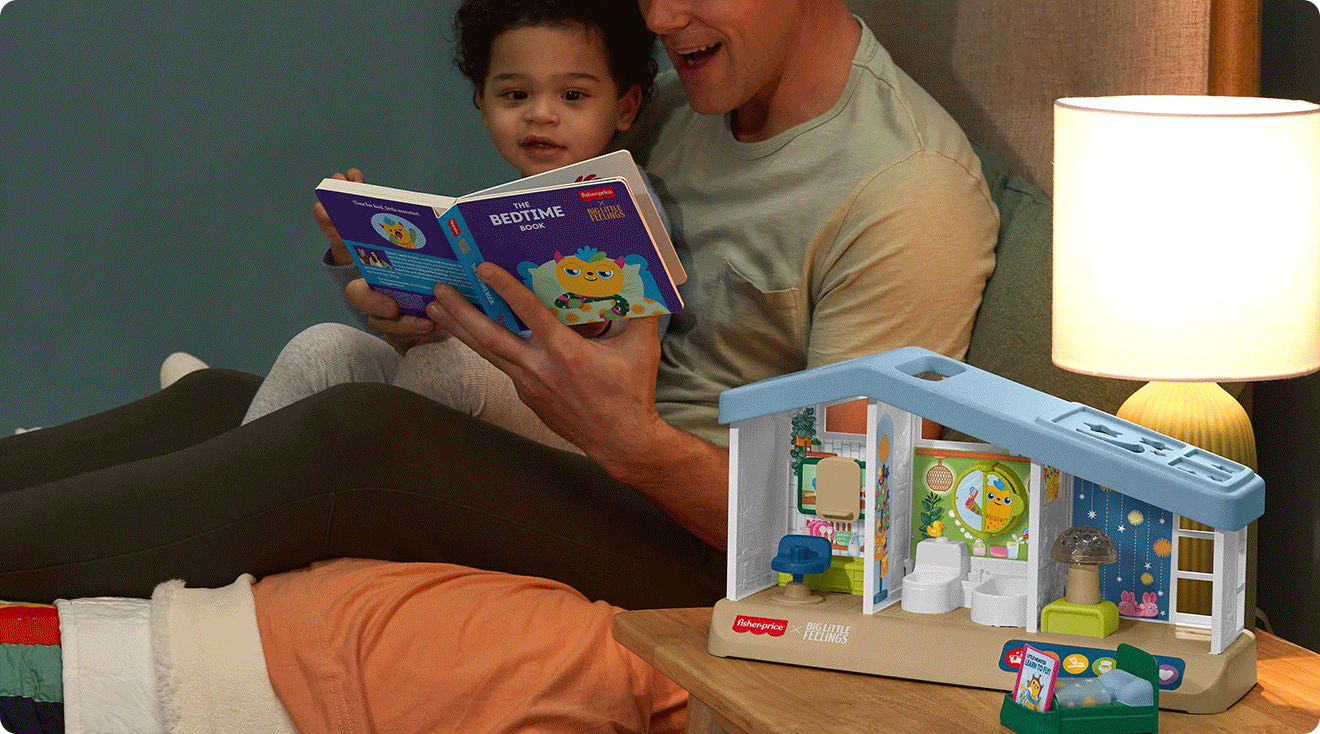 father and son using fisher price big little feelings bedtime kit