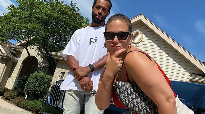 Ashley Graham and her husband Justin Ervin outside their house