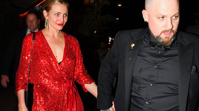 cameron diaz in red dress walking with husband benji madden