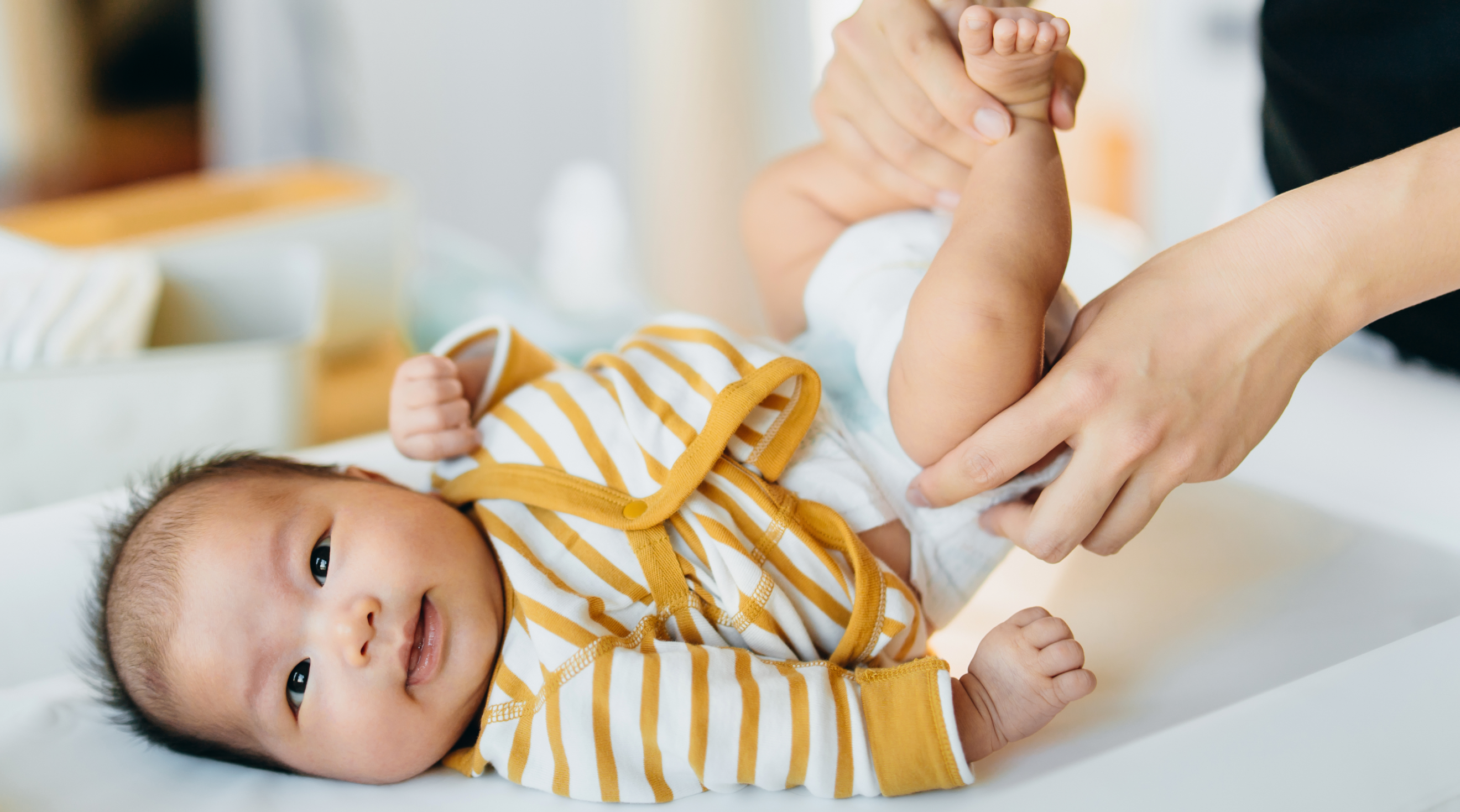 baby on changing table