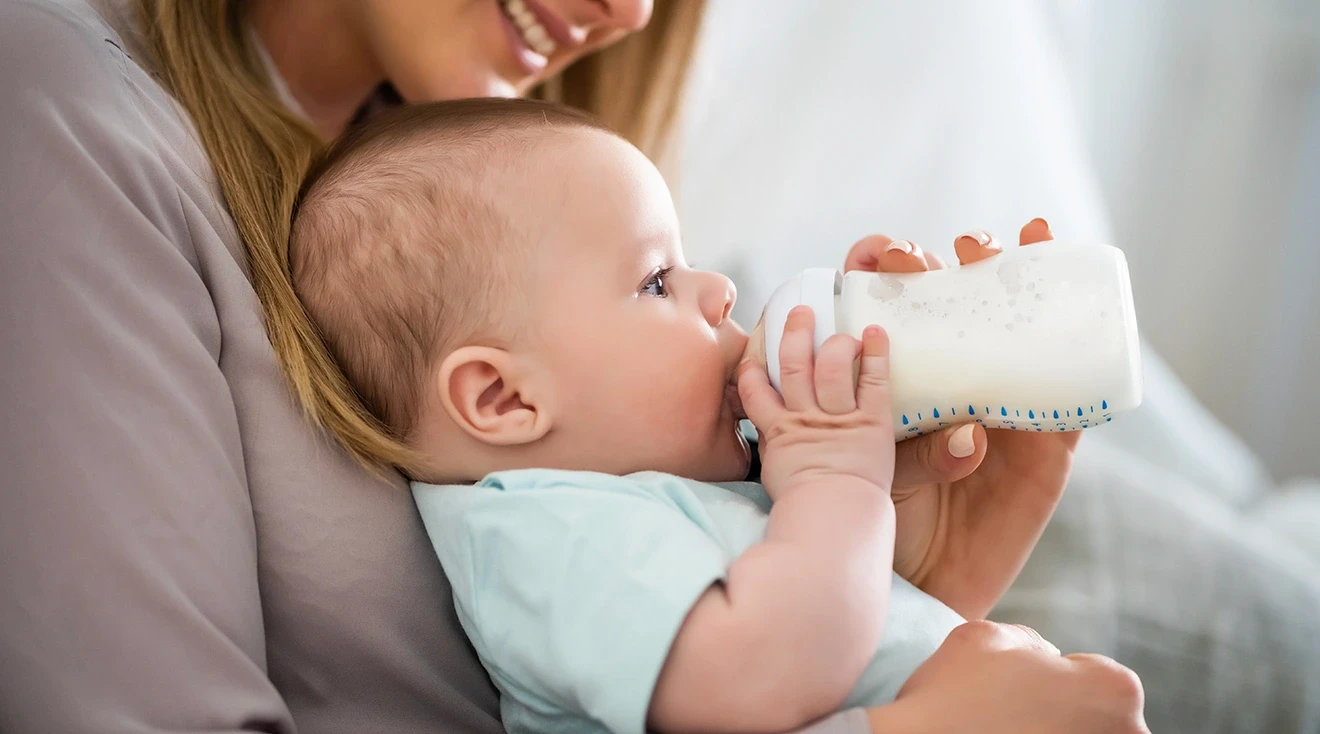 baby drinking from bottle