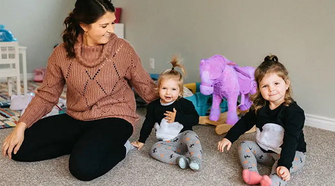 Mom with her two toddler daughters who are close in age. 