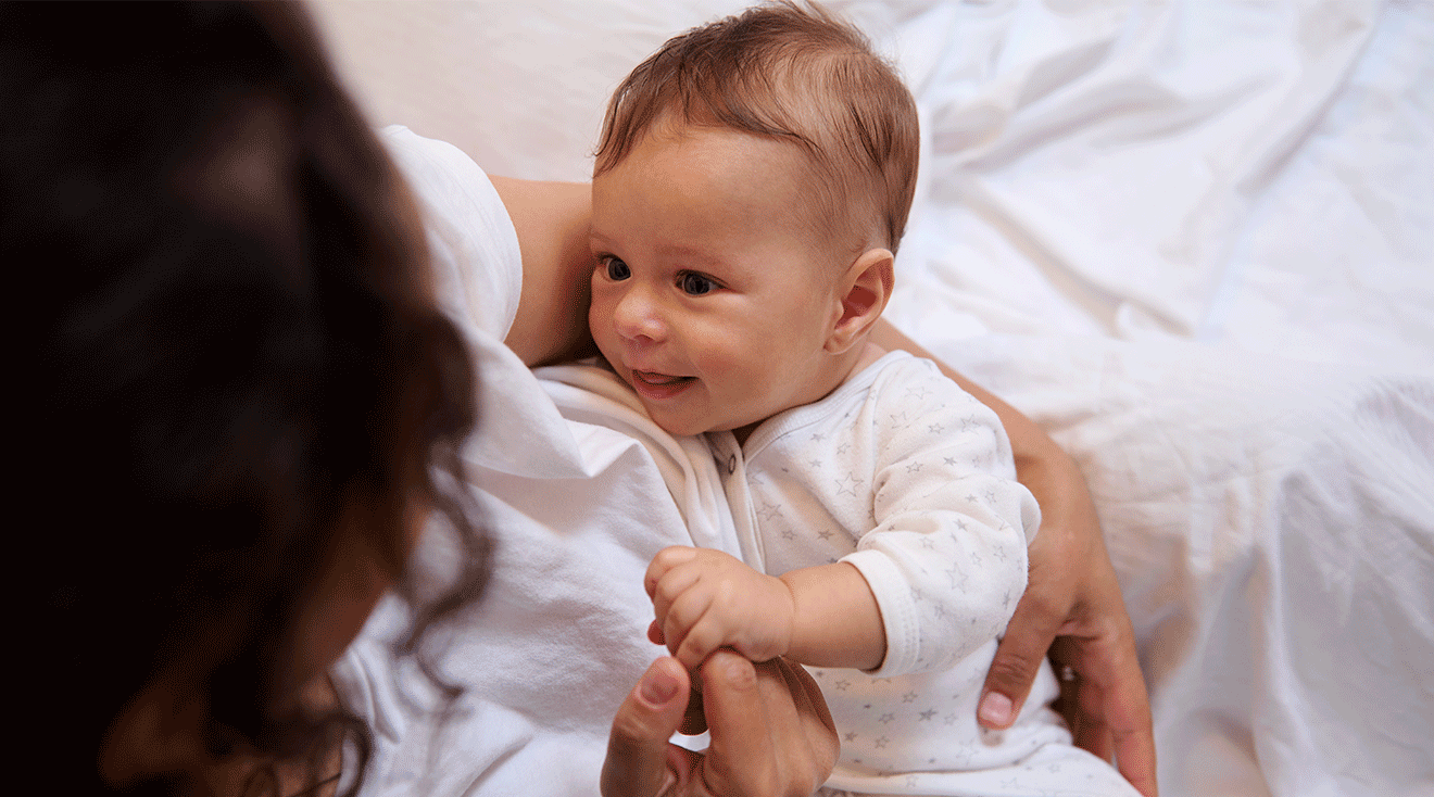 mom holding baby in arms