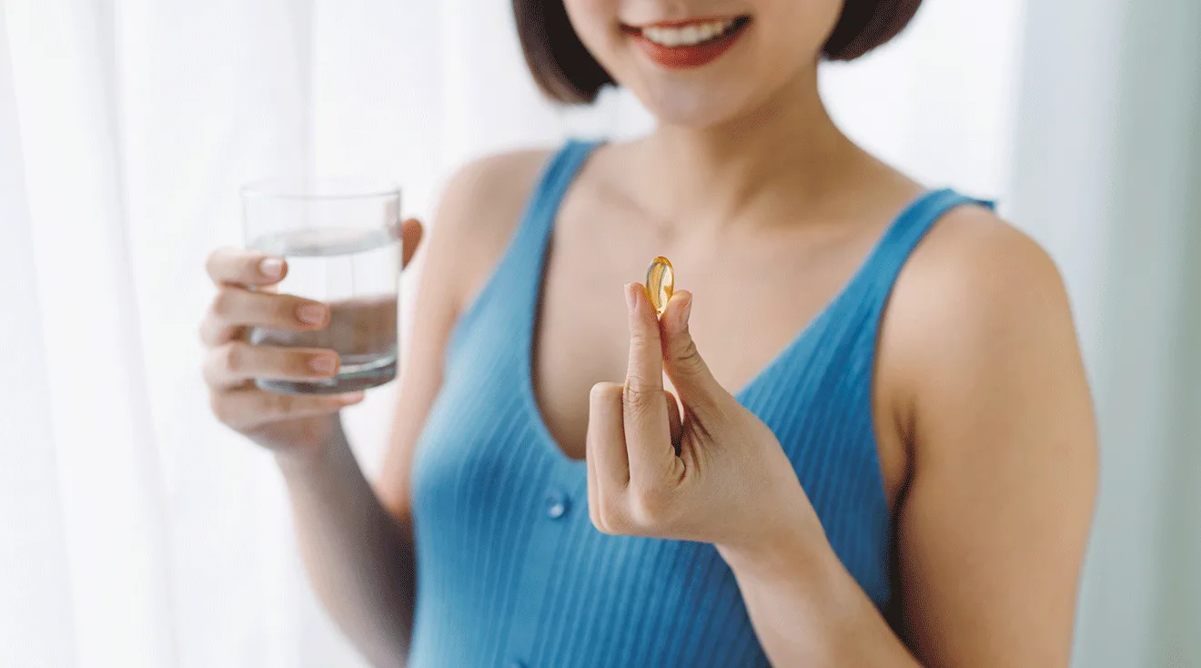 woman taking a vitamin
