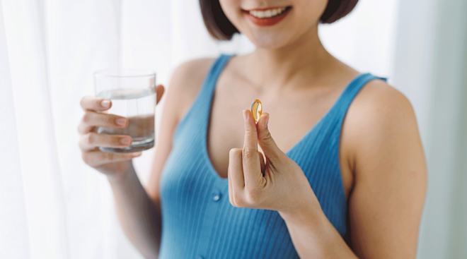 woman taking a vitamin