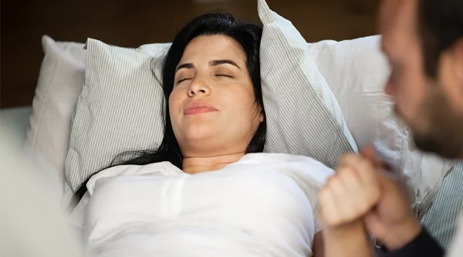 woman in labor with eyes closed