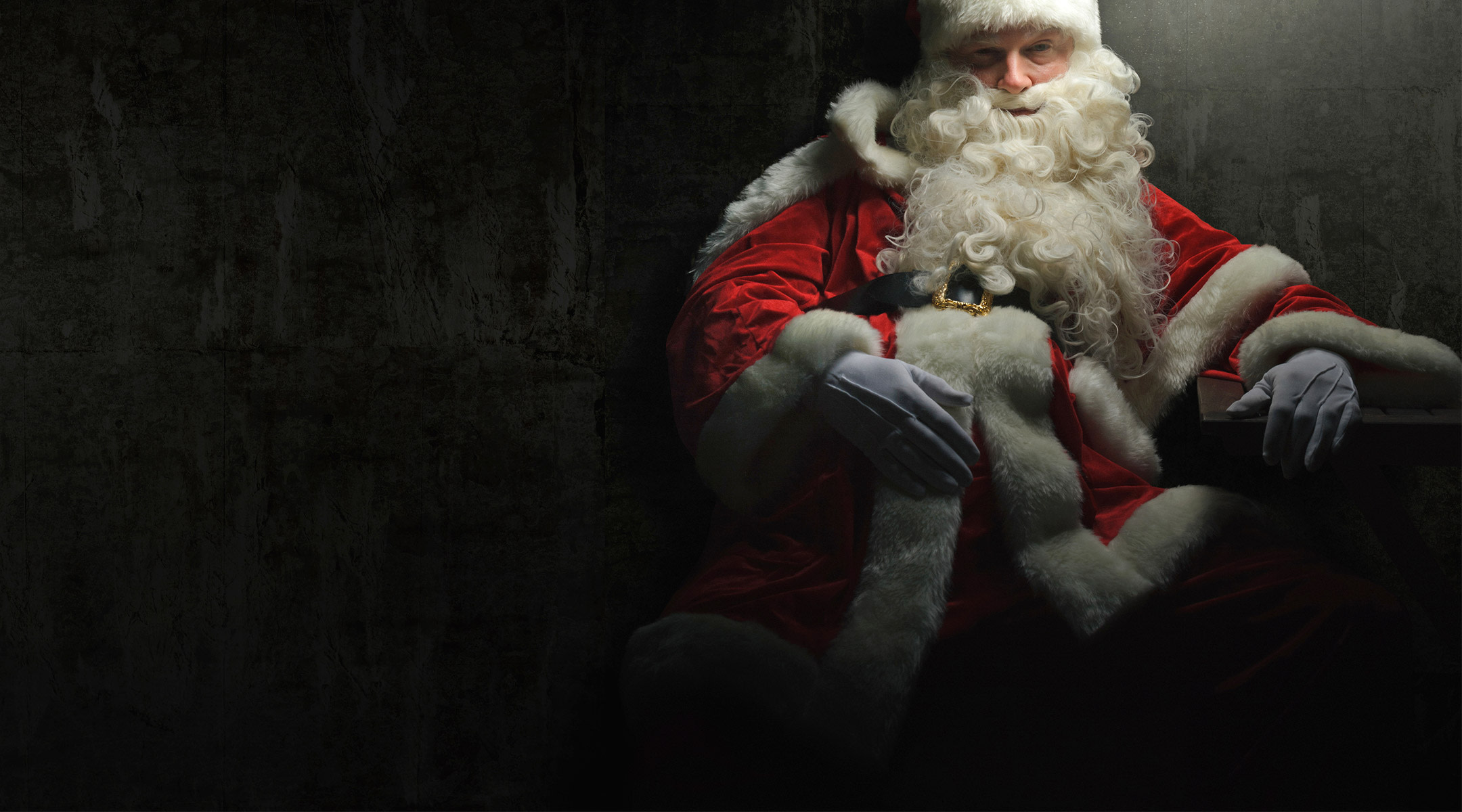 mean santa sitting in dark room