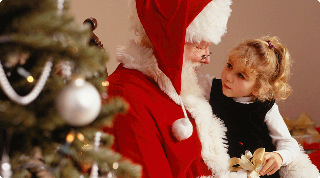 little girl sitting on santa's lap