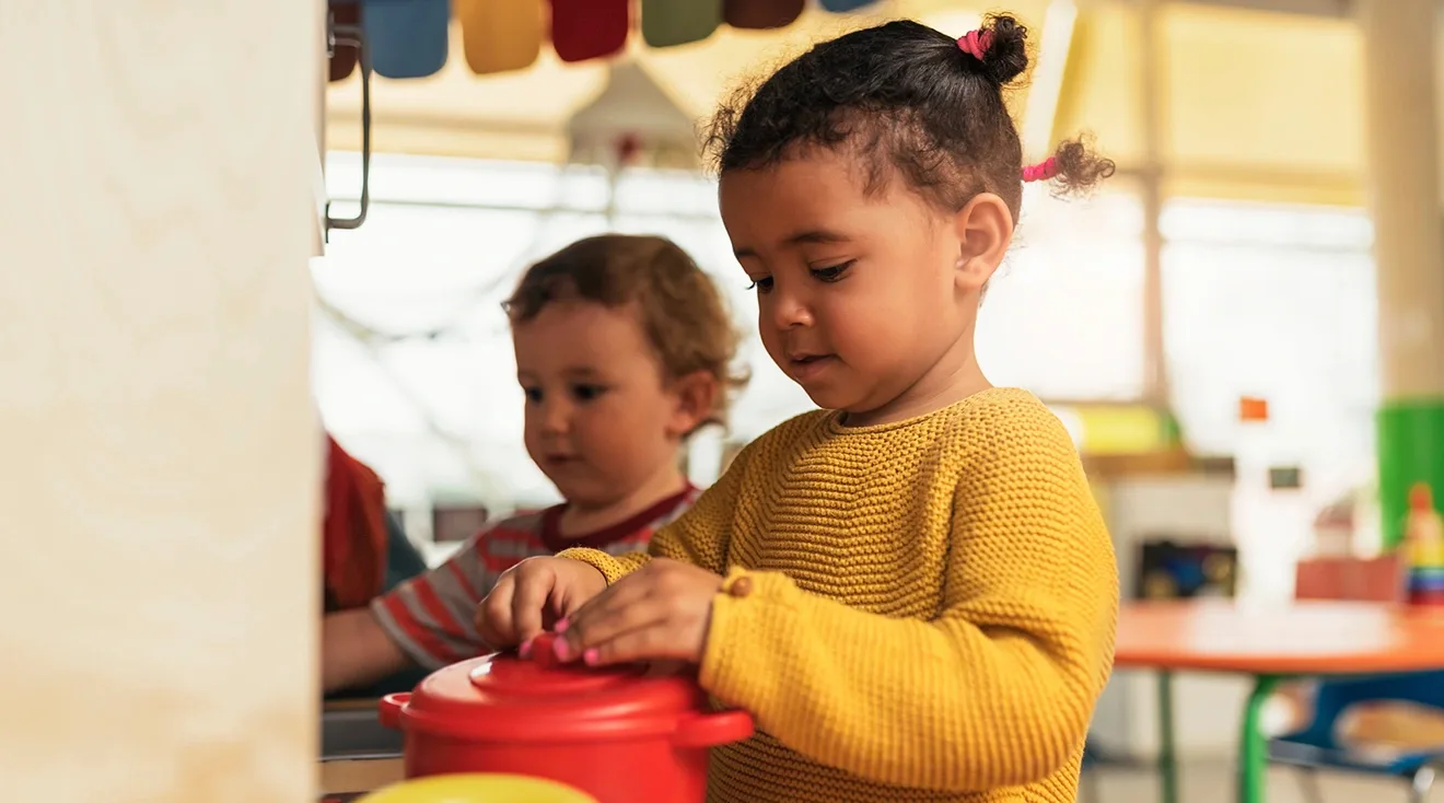 toddlers playing side by side