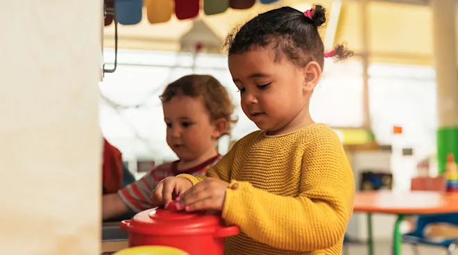 toddlers playing side by side