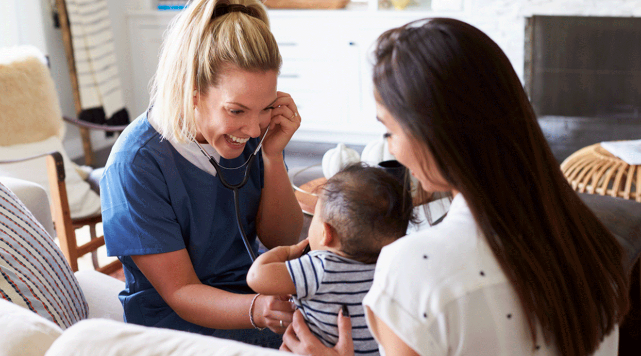 nurse examining baby at home