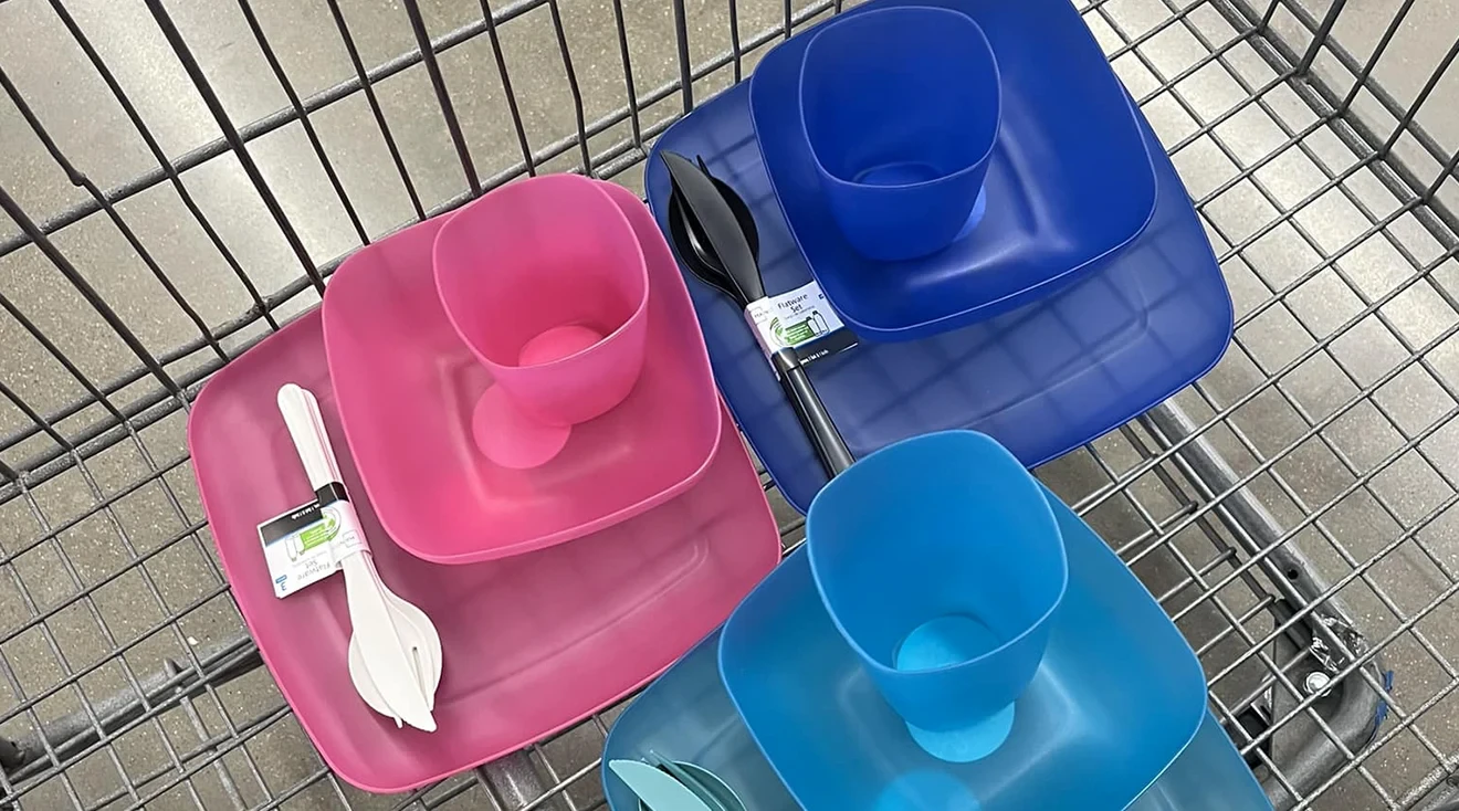 colored kids plates bowls and cups in shopping cart