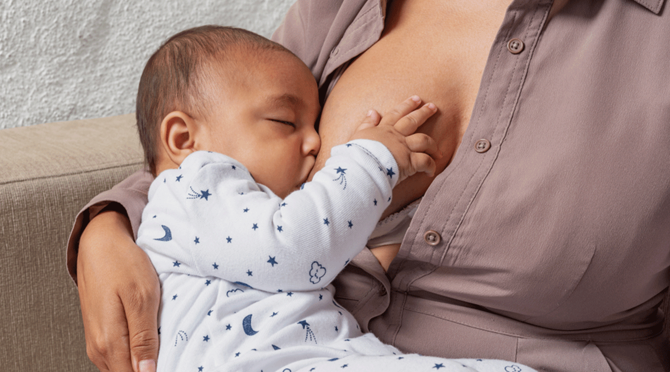 mother breastfeeding baby at night for dream feed