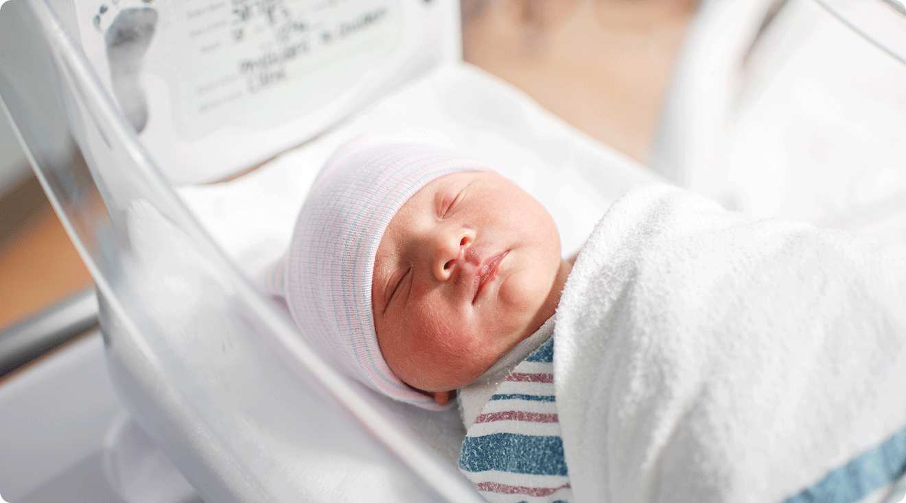 swaddled newborn baby in hospital