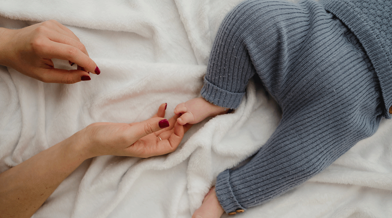 mom touching baby's legs