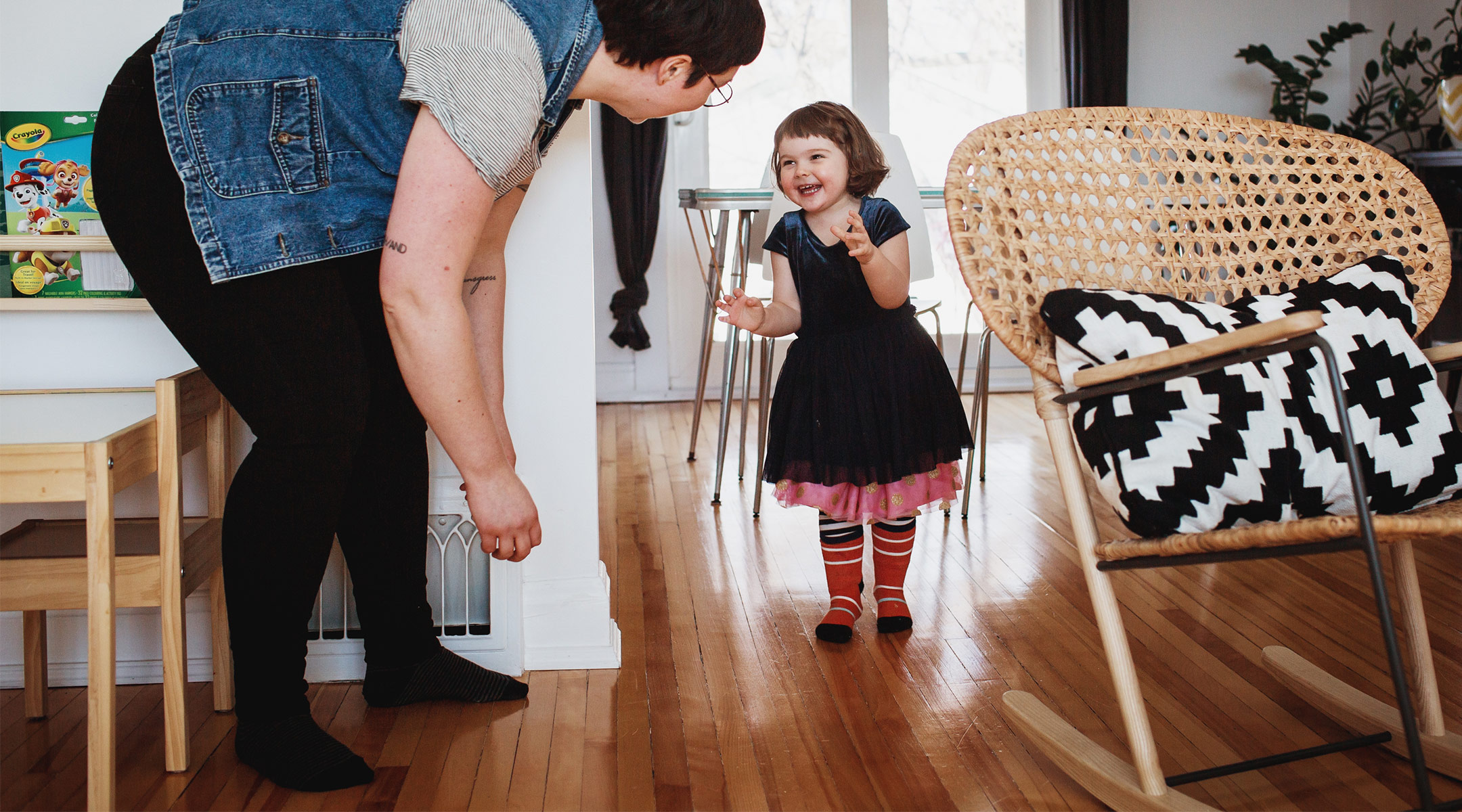 happy toddler talking to her parent