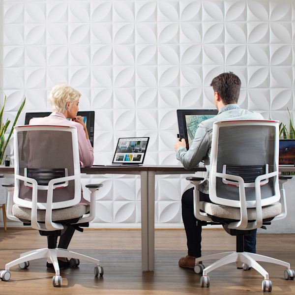 touchscreen computer monitor in a modern commercial office setting with ergonomic task chairs