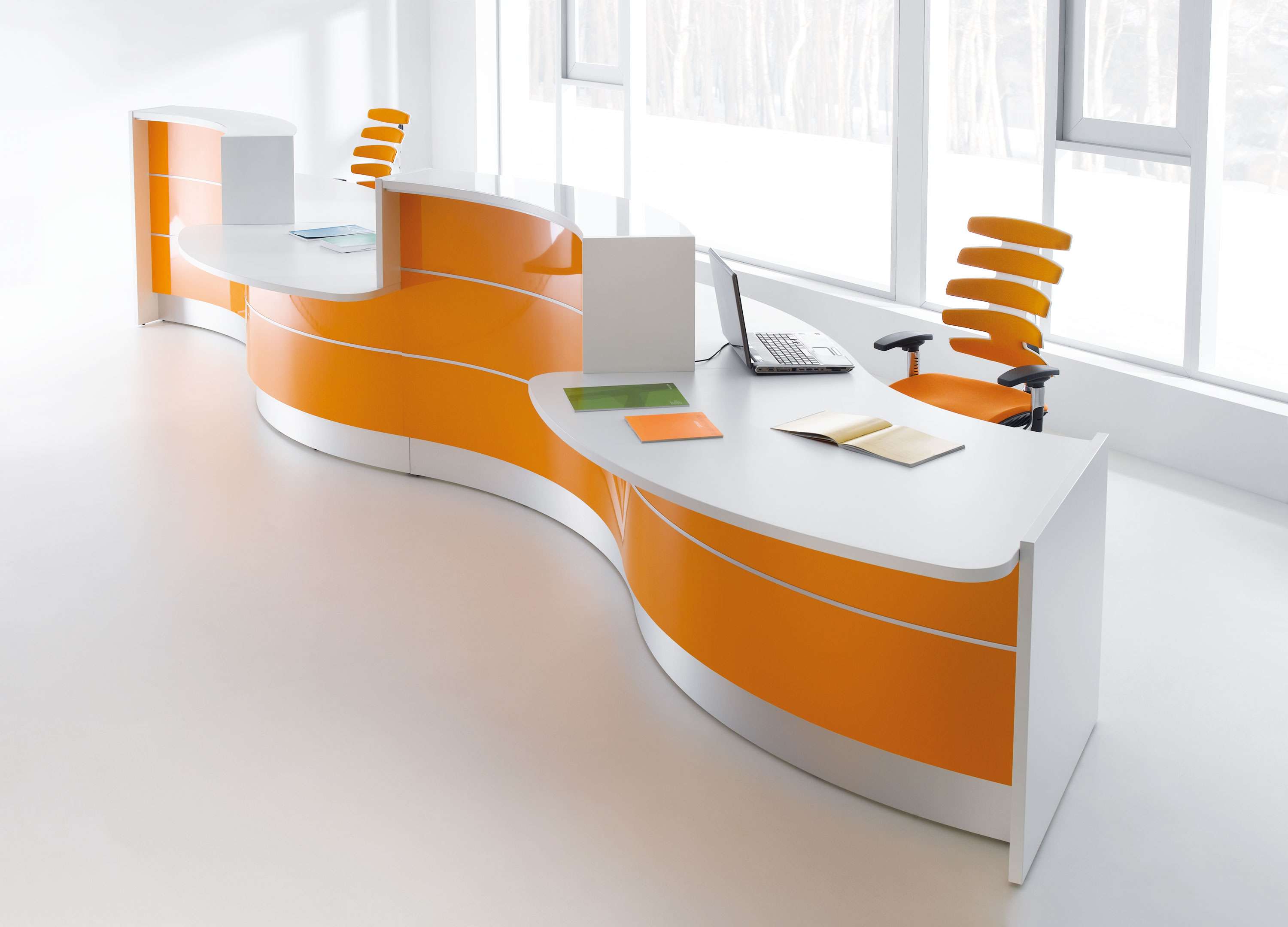 curved modern reception desk with natural light and ergonomic task chairs