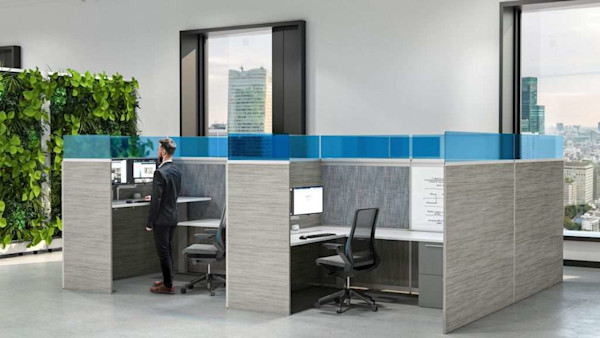 adjustable height standing desk with modern ergonomic desk chairs in a modular workstation and modern cubicle