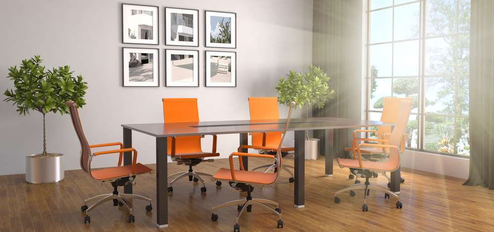 Office conference table with orange chairs