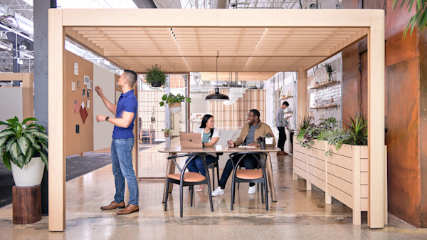 flexible office design for collaboration with partitions and biophilics