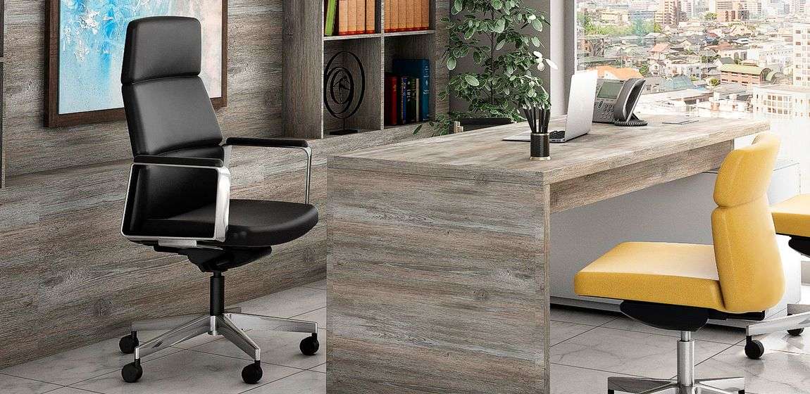 executive ergonomic chairs at desk in large office