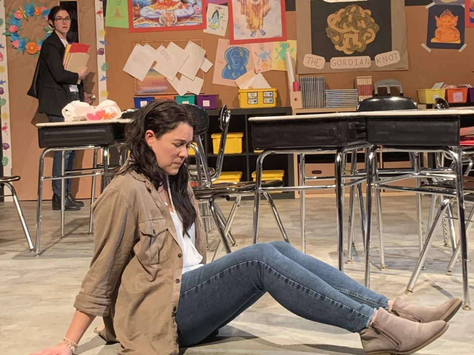Production shot of Gidion's Knot in New York, with Christina Loper as Corryn and Misha Vo as Heather sitting on the floor.