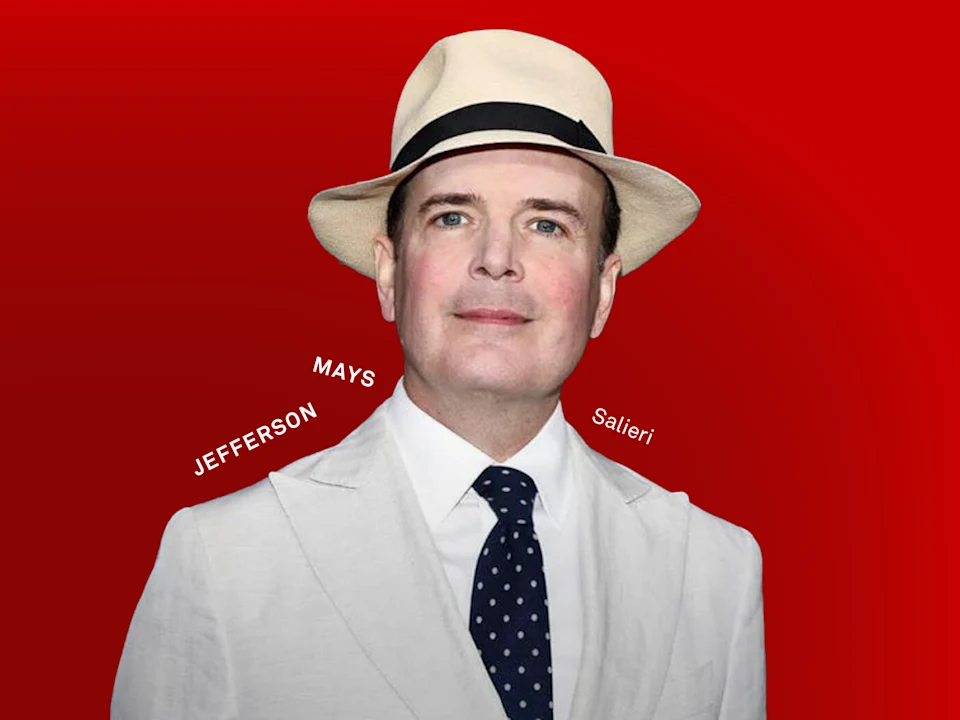 A man in a white suit, white fedora, and navy polka dot tie stands against a red background. The names "JEFFERSON," "MAYS," and "Salieri" appear beside him.