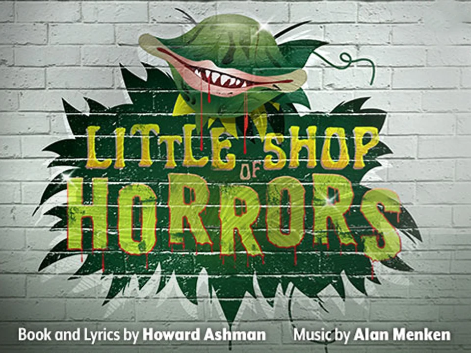 A green carnivorous plant with sharp teeth and text. Book and lyrics by Howard Ashman, music by Alan Menken.