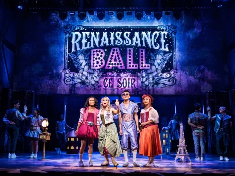 A theatrical performance with four characters in front stage dressed in vibrant costumes. A large illuminated sign reads "Renaissance Ball Ce Soir" in the background.