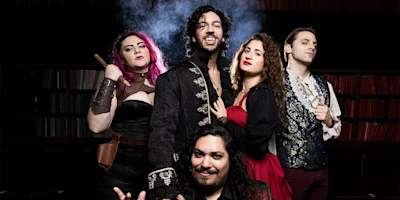 Five people in fantasy-themed costumes pose confidently together, with a smoky backdrop and shelves of books behind them.