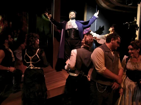 Production photo of Sweeney Todd: The Demon Barber of Fleet Street in California with Emmanuel Madera as Adolfo Pirelli and the cast.
