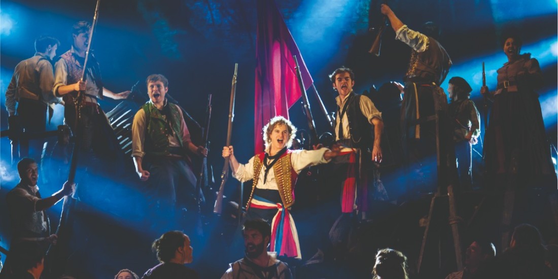 Photo credit: Ashley Gilmour as Enjolras, Harry Apps as Marius and Company in Les Misérables (Photo by Johan Persson)
