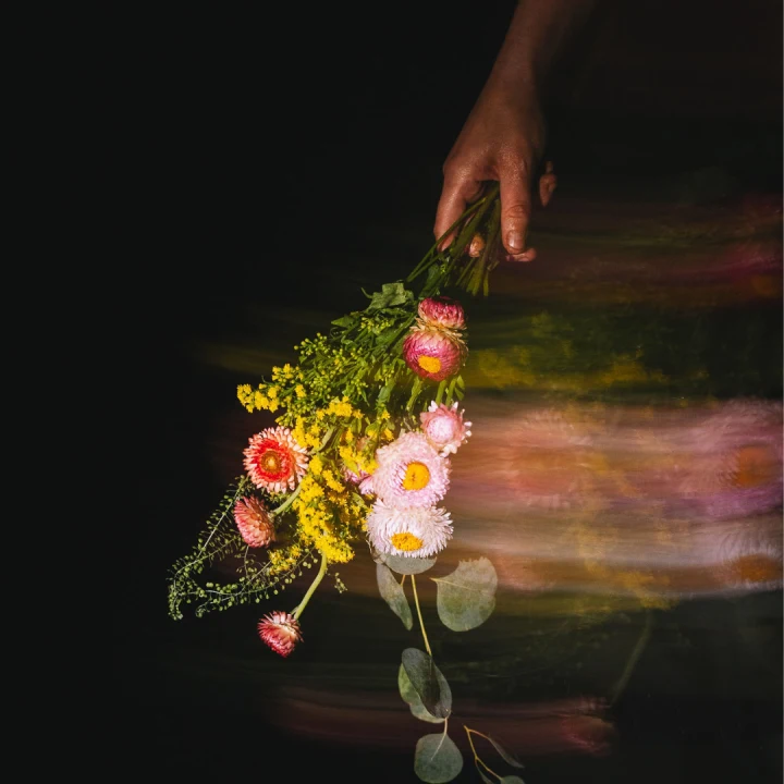 Production shot of Hamlet in Chicago showing a woman holding flowers.