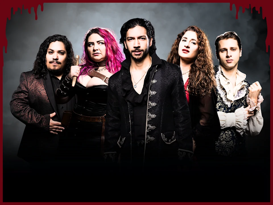 Five people in dramatic, gothic costumes stand in a row against a dark, cloudy background, with red borders resembling dripping blood along the top edge of the image.