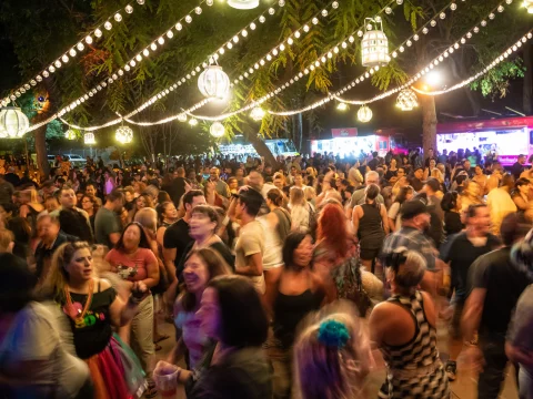 Production shot of Roaring Nights in Los Angeles, showing people dancing & food trucks.