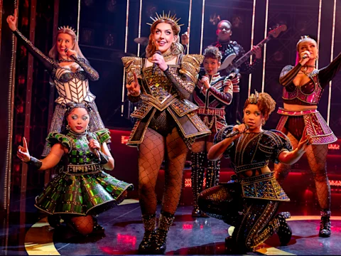 Production shot of Six in London featuring the company.