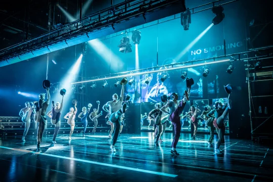 Production Image of A Chorus Line in Leicester Curve from 2021, featuring the full cast ensemble rehearsing the finale number.