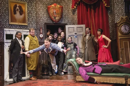 Production shot of The Play That Goes Wrong in London, featuring the 2024 company