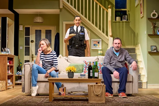 Production shot of The Unfriend in London, with Sarah Alexander as Debbie, Lee Mack as Peter and Muzz Khan as PC Junkin.