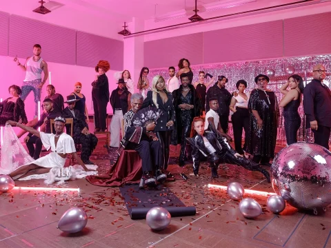 Production shot of CATS: "THE JELLICLE BALL" in New York, showing ensemble partying with pink lighting, silver balloons, confetti, and a large disco ball.